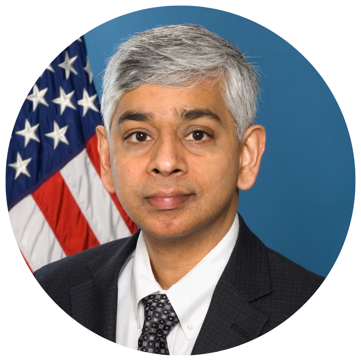 Venke Sankaran Picture of a man in a suite in front of the US flag