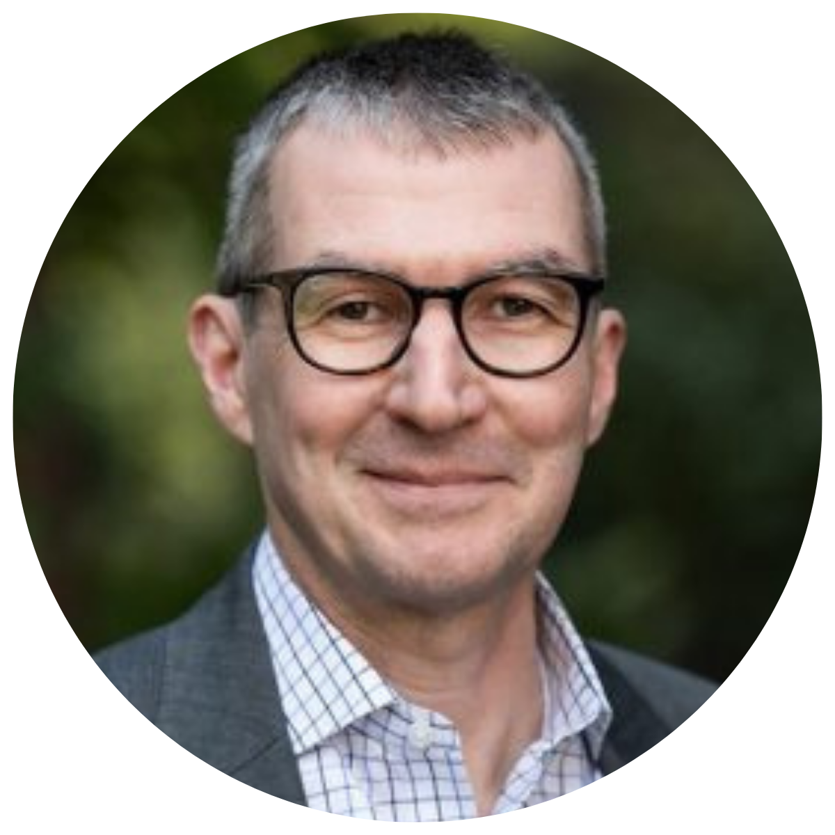 man in gray suit wearing glasses