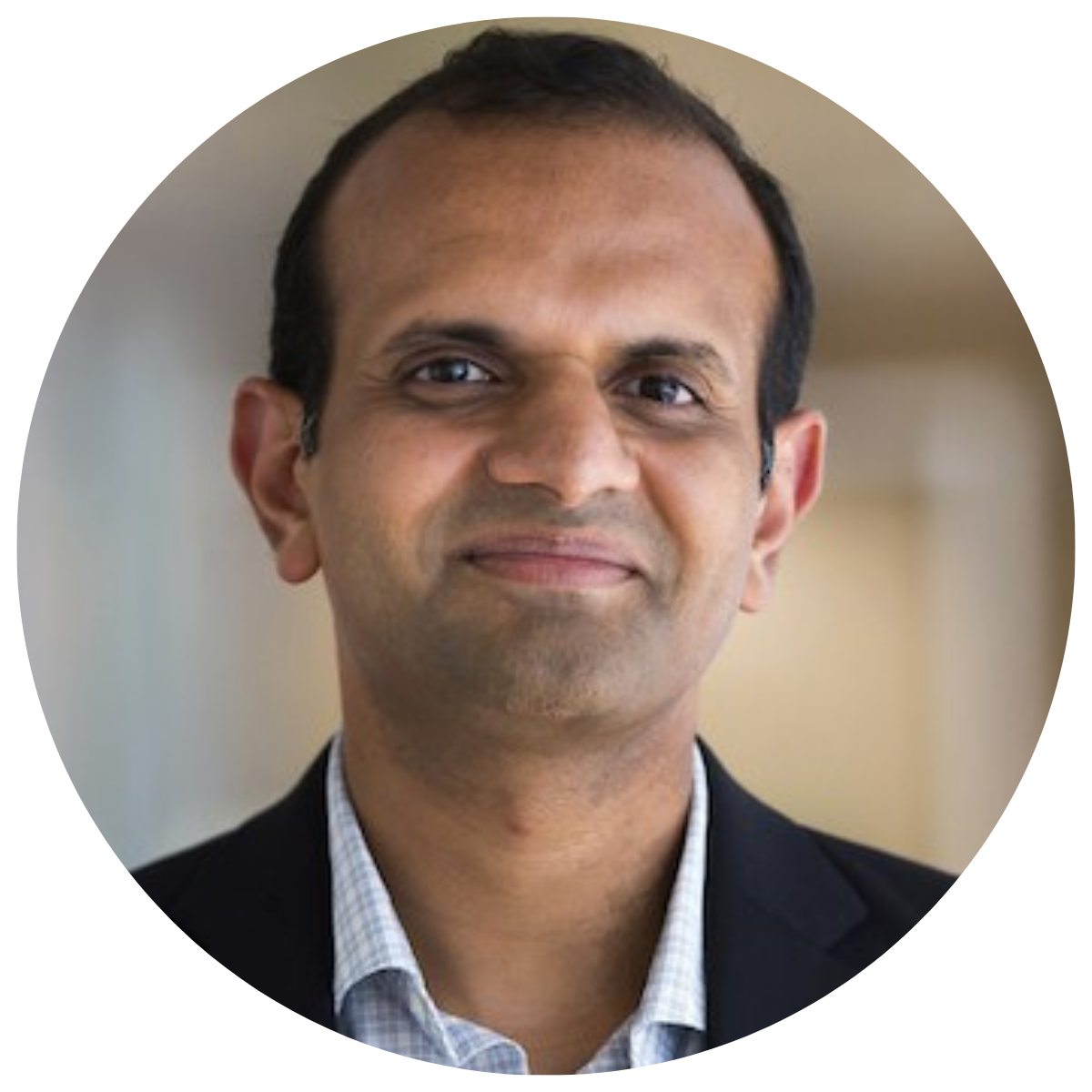 Venkat Raman man in gray shirt wearing glasses