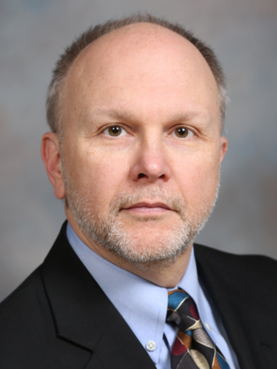 Portrait of a man in dark suit