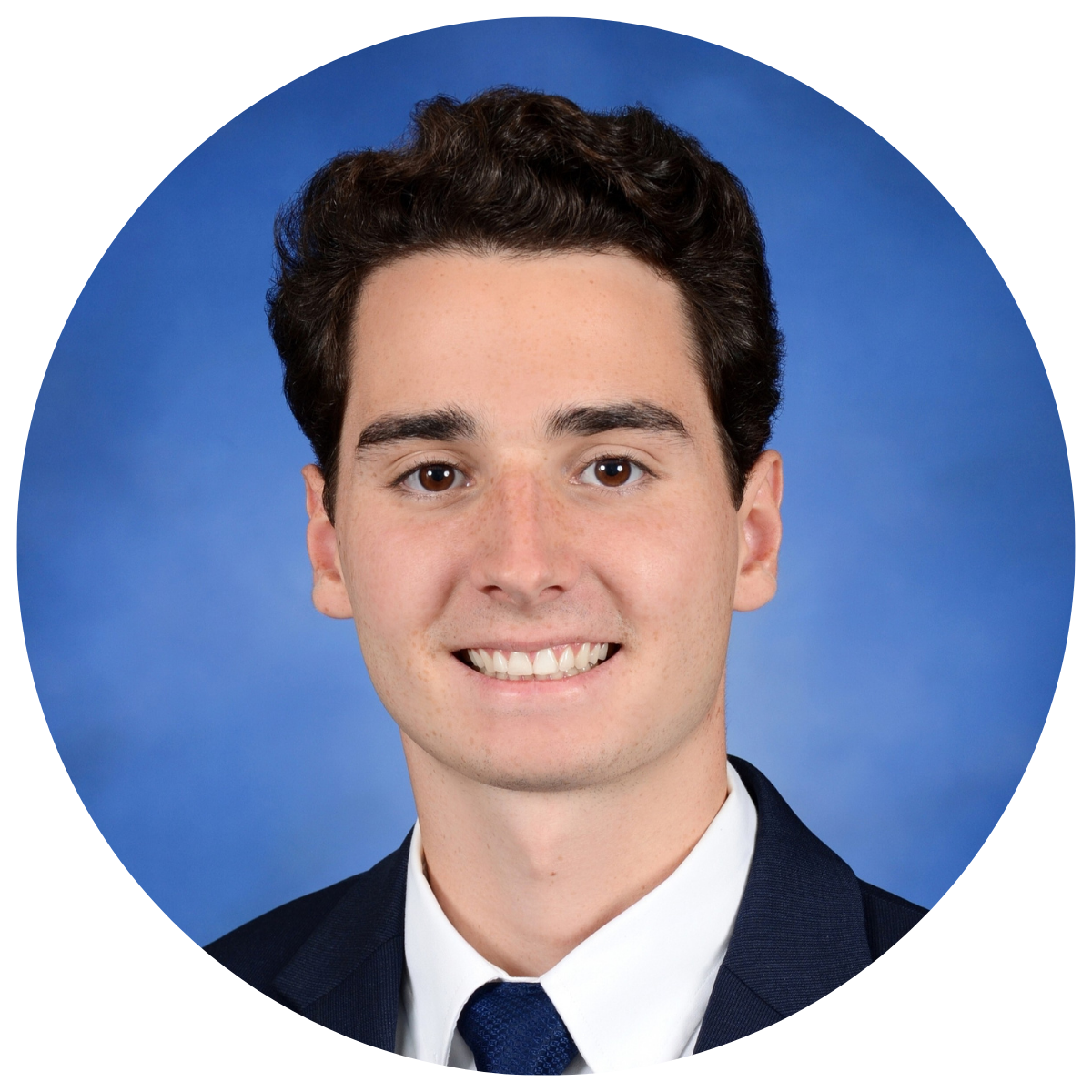 Young man in dark suite smiling