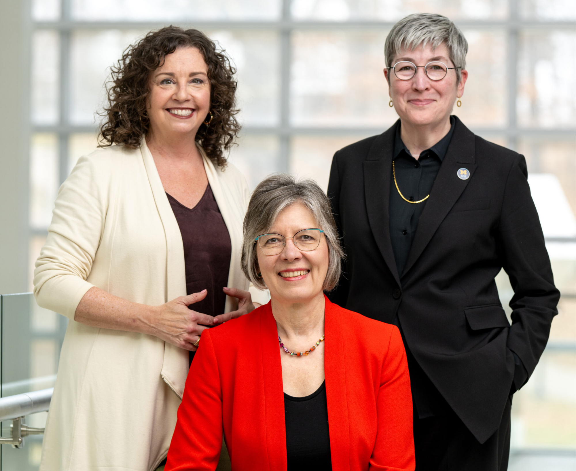 Three women smiling