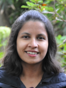Woman in black shirt smiling